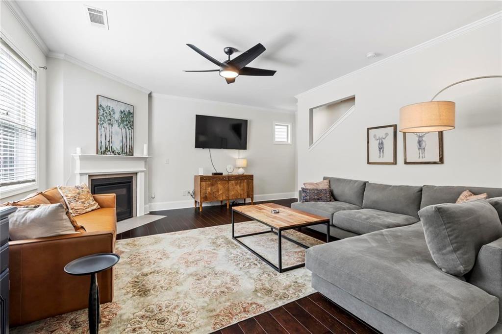 2426 Fair Oaks Way Atlanta, GA 30337 - Photo 11 of 29 a living room with furniture a fireplace and a flat screen tv