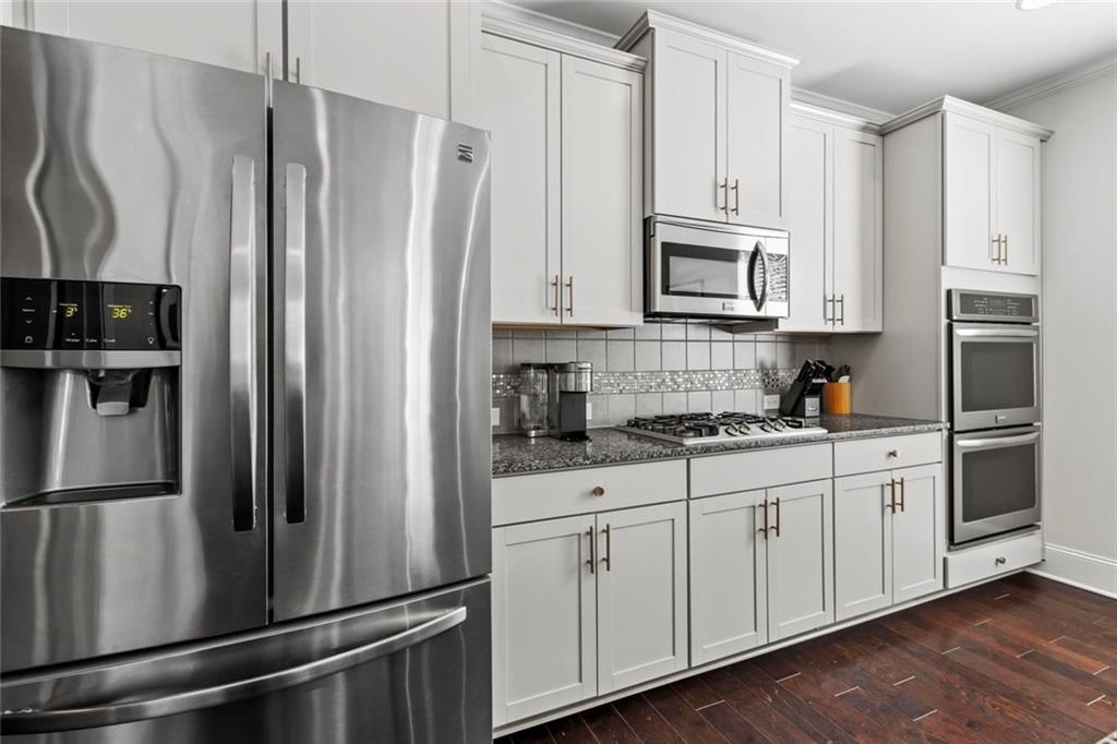 2426 Fair Oaks Way Atlanta, GA 30337 - Photo 15 of 29 a kitchen with stainless steel appliances and refrigerator
