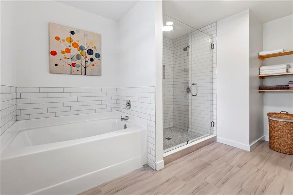 2426 Fair Oaks Way Atlanta, GA 30337 - Photo 20 of 29 a bathroom with a bathtub and a shower
