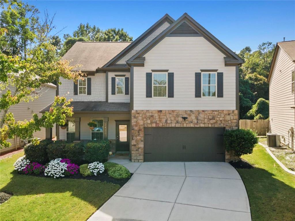 2426 Fair Oaks Way Atlanta, GA 30337 - Photo 2 of 29 a front view of a house with a garden