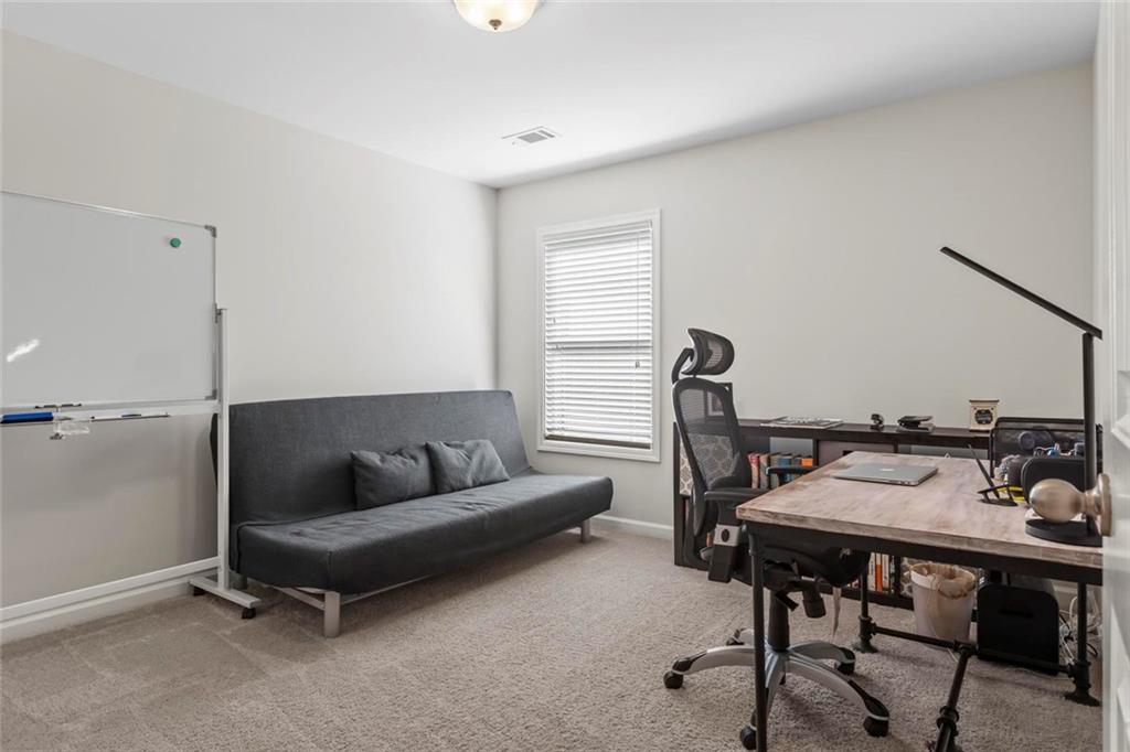 2426 Fair Oaks Way Atlanta, GA 30337 - Photo 23 of 29 a living room with furniture and a window