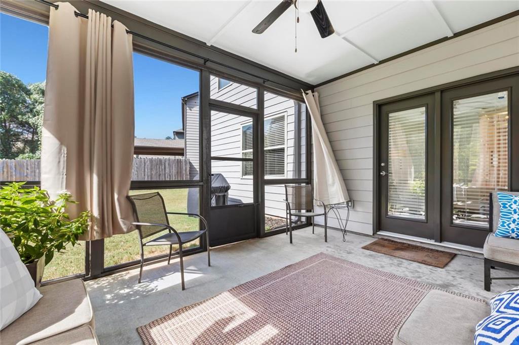 2426 Fair Oaks Way Atlanta, GA 30337 - Photo 28 of 29 a living room with furniture and a floor to ceiling window