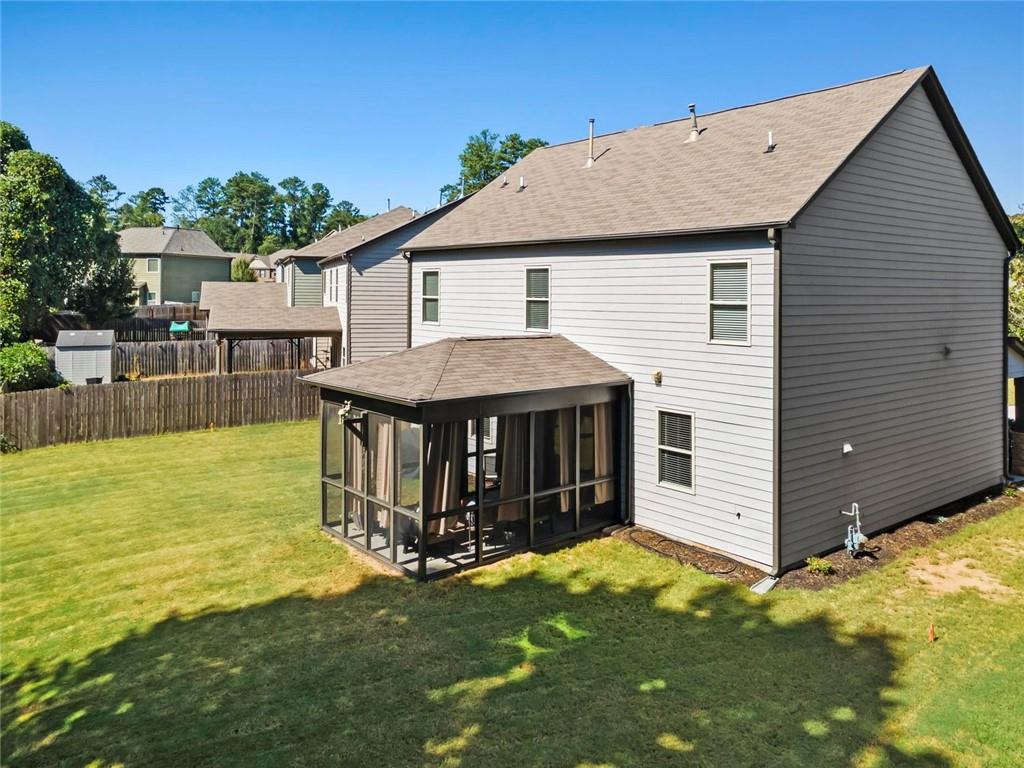 2426 Fair Oaks Way Atlanta, GA 30337 - Photo 4 of 29 a view of a house with a yard and sitting area
