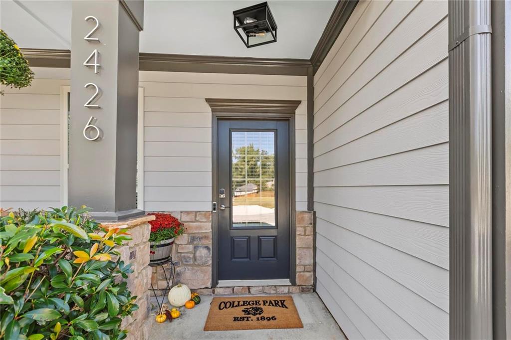 2426 Fair Oaks Way Atlanta, GA 30337 - Photo 6 of 29 a door view with a outdoor space