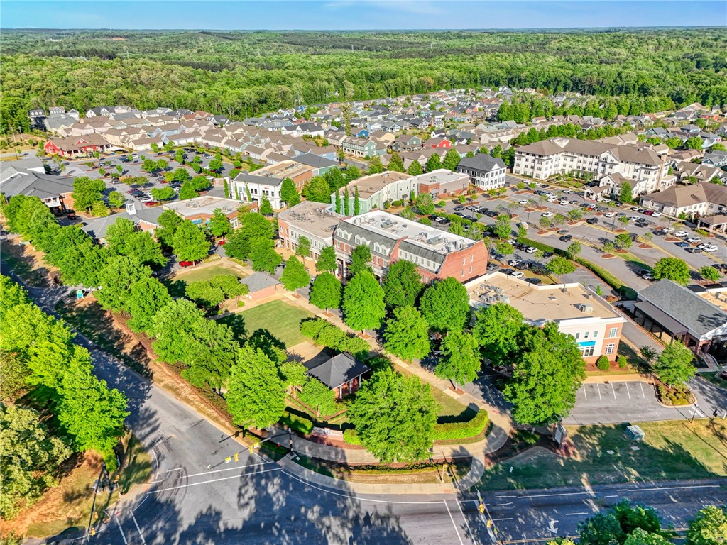 118 Tuttle Street Clemson, SC 29631 - Photo 5 of 9 An aerial perspective reveals a vibrant community with diverse architecture, abundant green spaces, and ample parking.