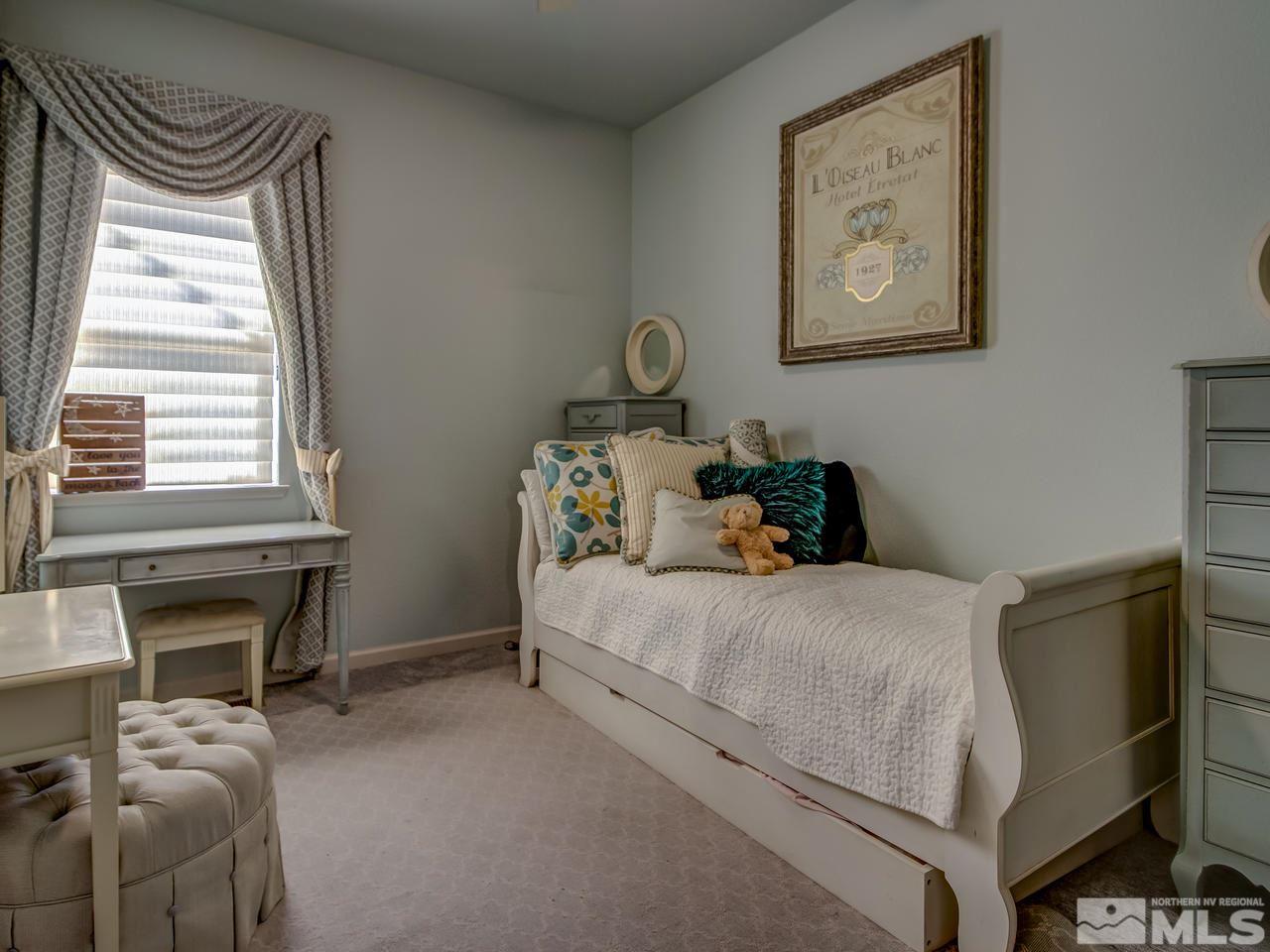 1614 Commonwealth Circle Reno, NV 89503 - Photo 14 of 21 a bedroom with a bed and a window