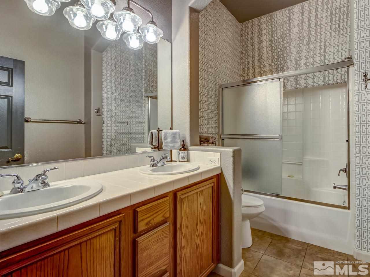 1614 Commonwealth Circle Reno, NV 89503 - Photo 16 of 21 a bathroom with a sink a toilet and shower