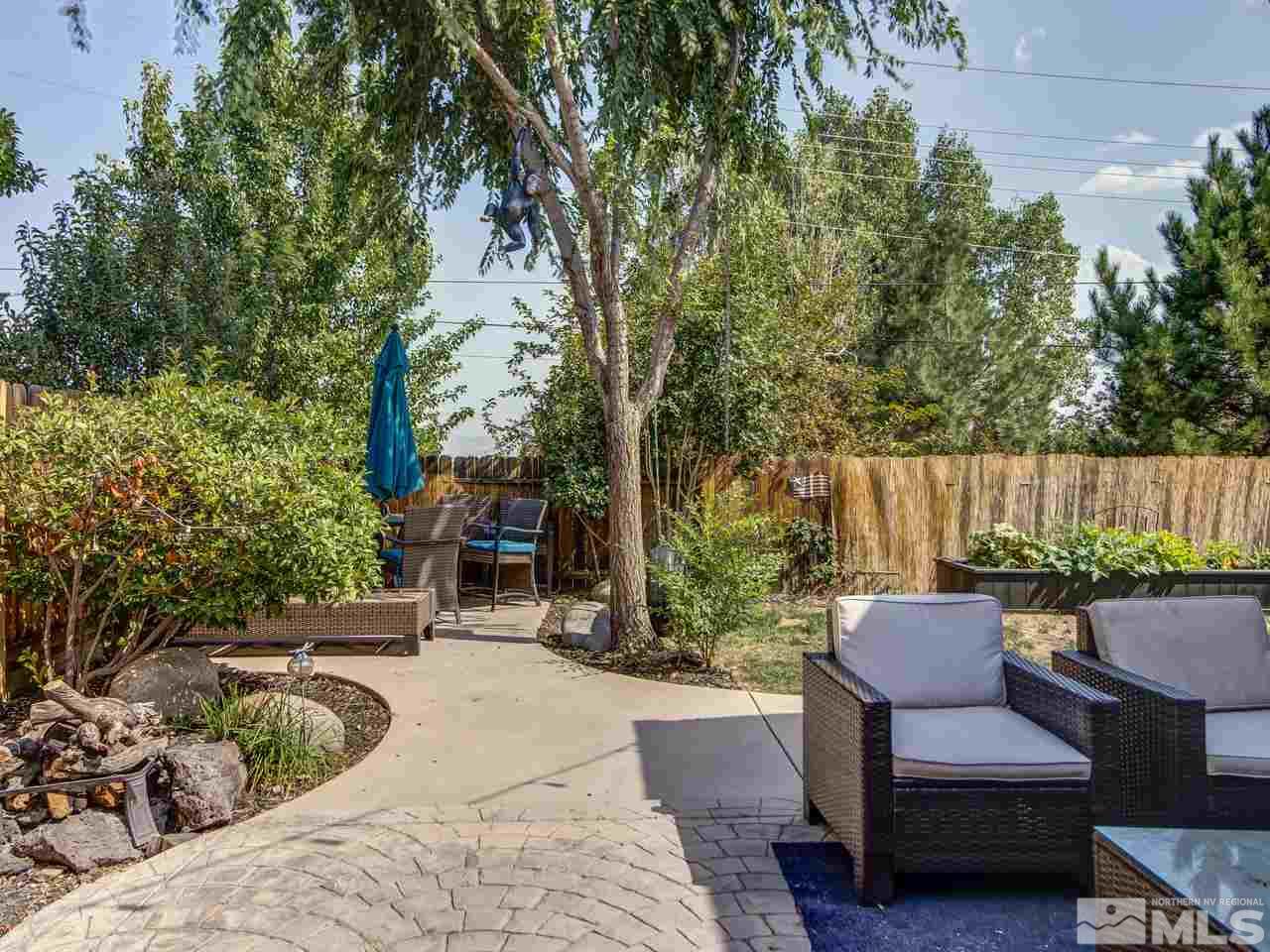 1614 Commonwealth Circle Reno, NV 89503 - Photo 18 of 21 a backyard of a house with table and chairs