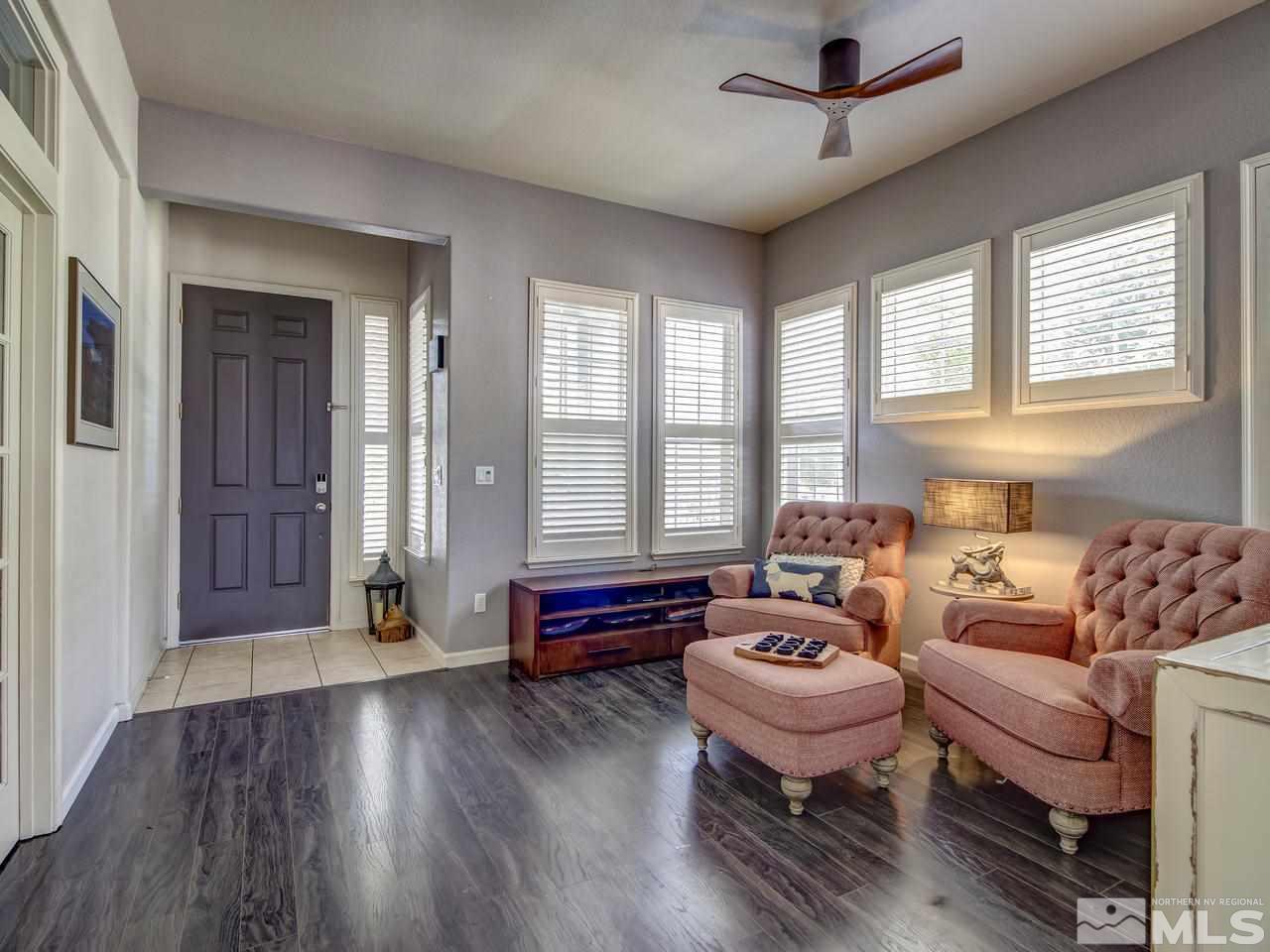 1614 Commonwealth Circle Reno, NV 89503 - Photo 3 of 21 a spacious bedroom with furniture and wooden floor