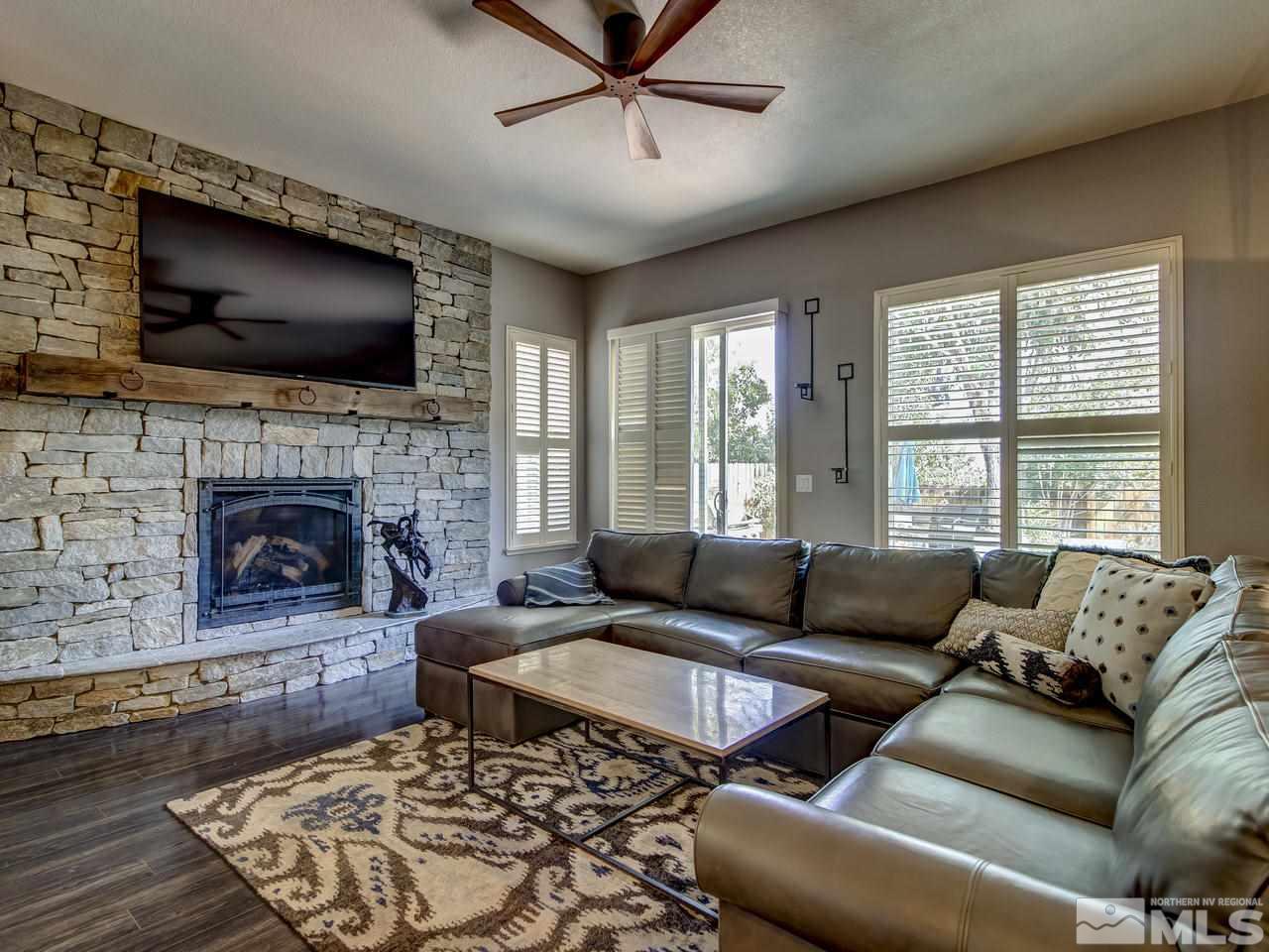 1614 Commonwealth Circle Reno, NV 89503 - Photo 6 of 21 a living room with furniture flat screen tv and a fireplace