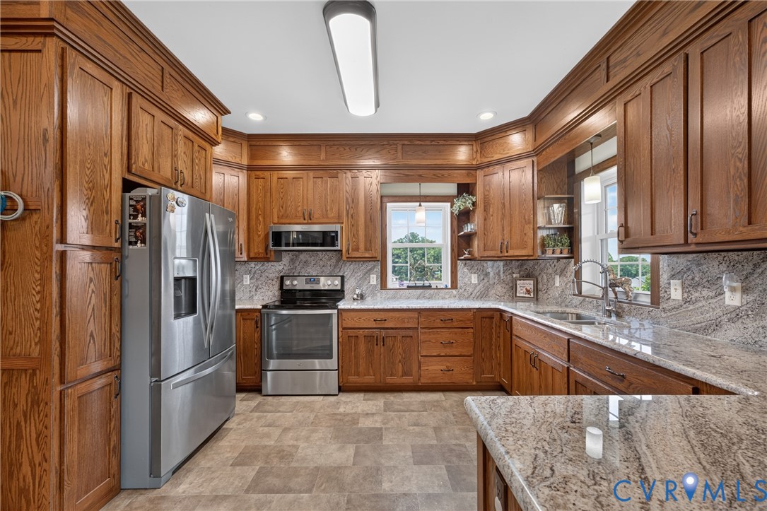 1292 Mohawk Road Long Island, VA 24569 - Photo 21 of 95 Kitchen featuring extensive wood cabinetry with cr
