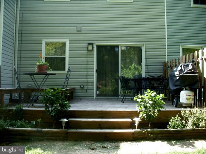 9321 Pan Ridge Road, Unit 9321 Parkville, MD 21234 - Photo 9 of 30 a front view of a house with garden