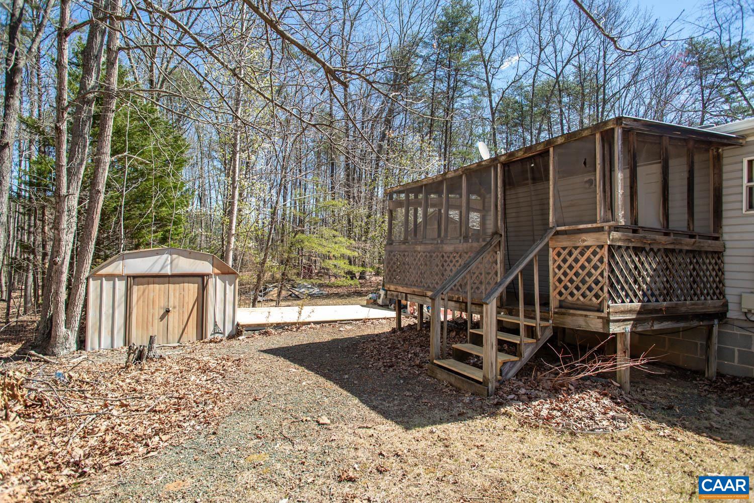 3147 Ridge Road Palmyra, VA 22963 - Photo 4 of 20 a backyard of a house with table and chairs