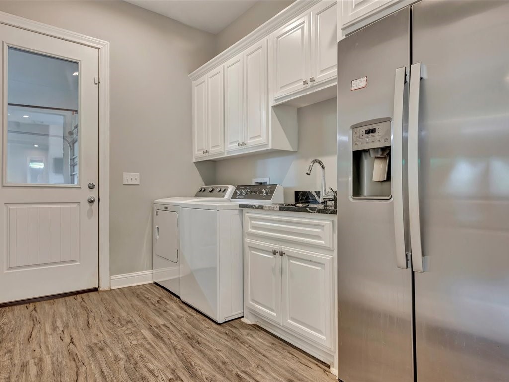 104 Wheeler Road Lufkin, TX 75901 - Photo 17 of 45 a kitchen with white cabinets and white appliances