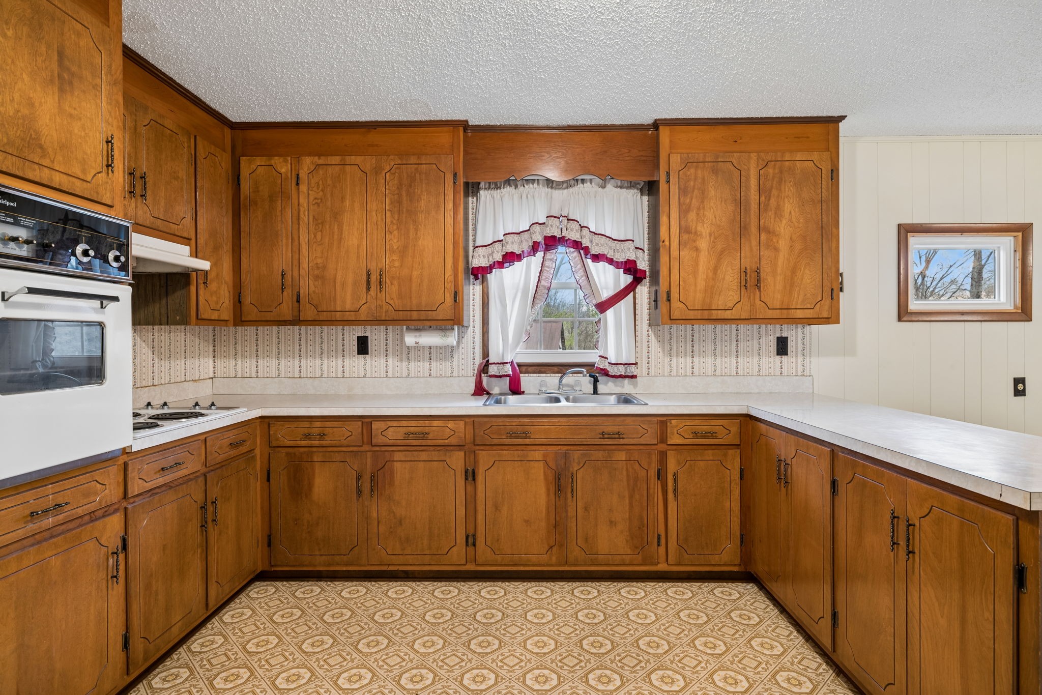 3335 Hill Town Road Santa Fe, TN 38482 - Photo 30 of 72 a kitchen with stainless steel appliances granite countertop a sink and cabinets