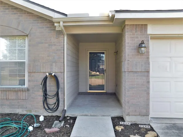a bathroom with a glass door shower and a sink