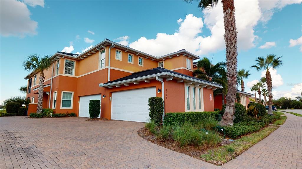 1266 Riverscape Street Bradenton, FL 34208 - Photo 1 of 1 a front view of a house with a yard and garage
