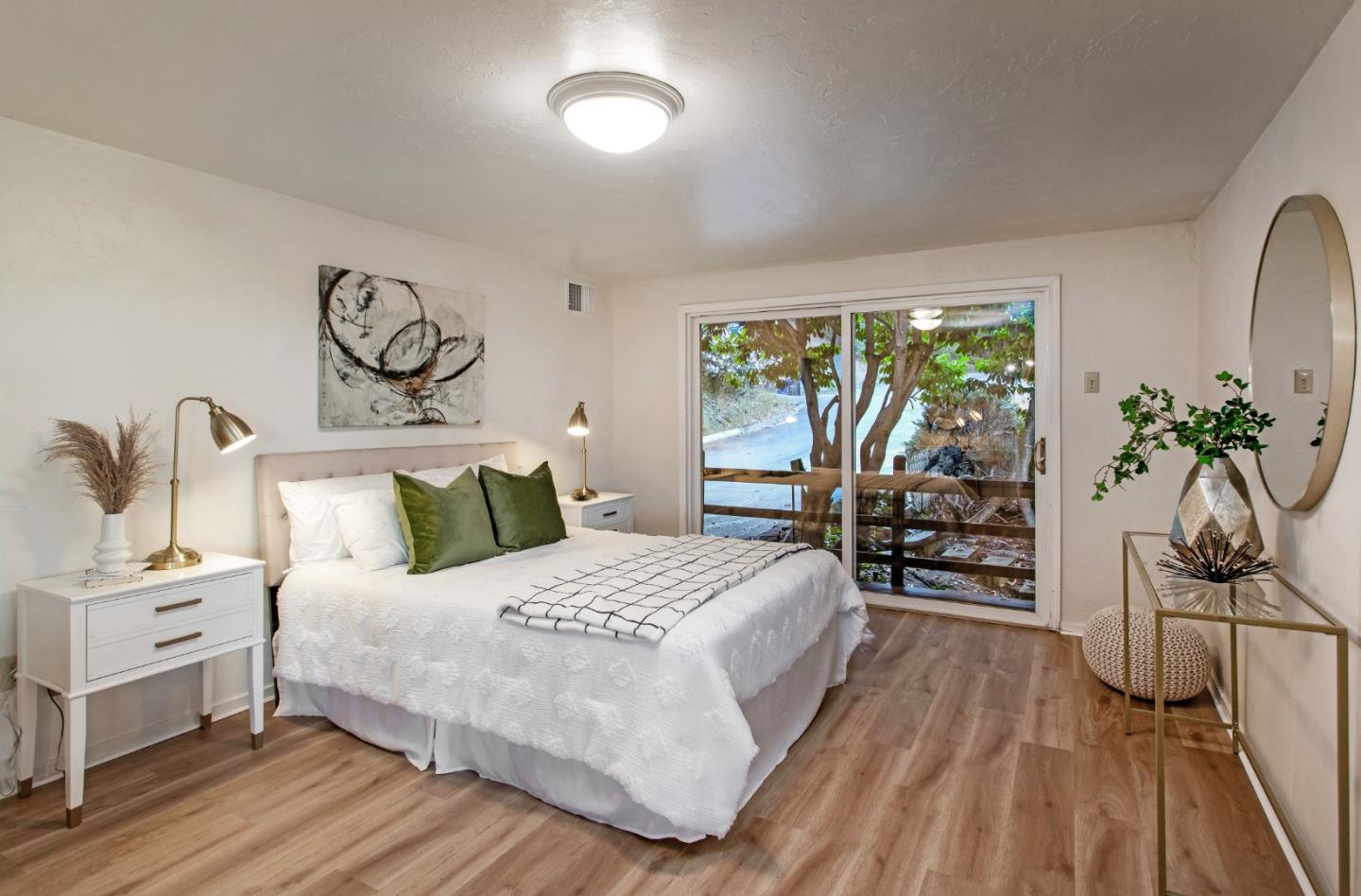 530 Summit Spring Road Woodside, CA 94062 - Photo 18 of 24 a bedroom with a bed and wooden floor