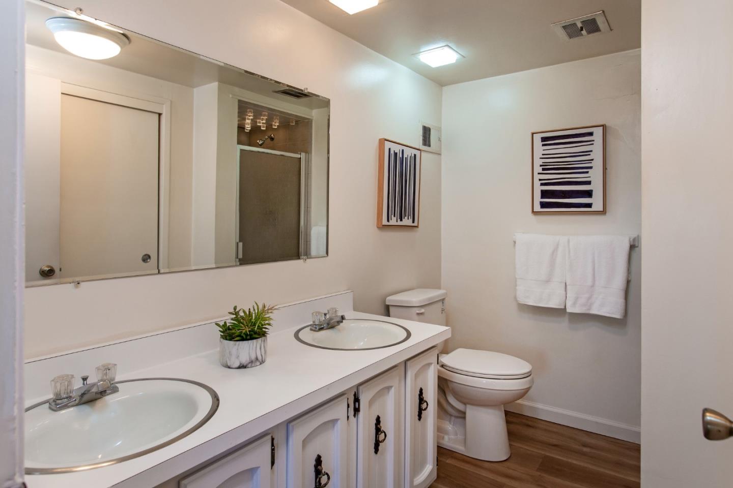 530 Summit Spring Road Woodside, CA 94062 - Photo 20 of 24 a bathroom with a granite countertop sink toilet a mirror and shower