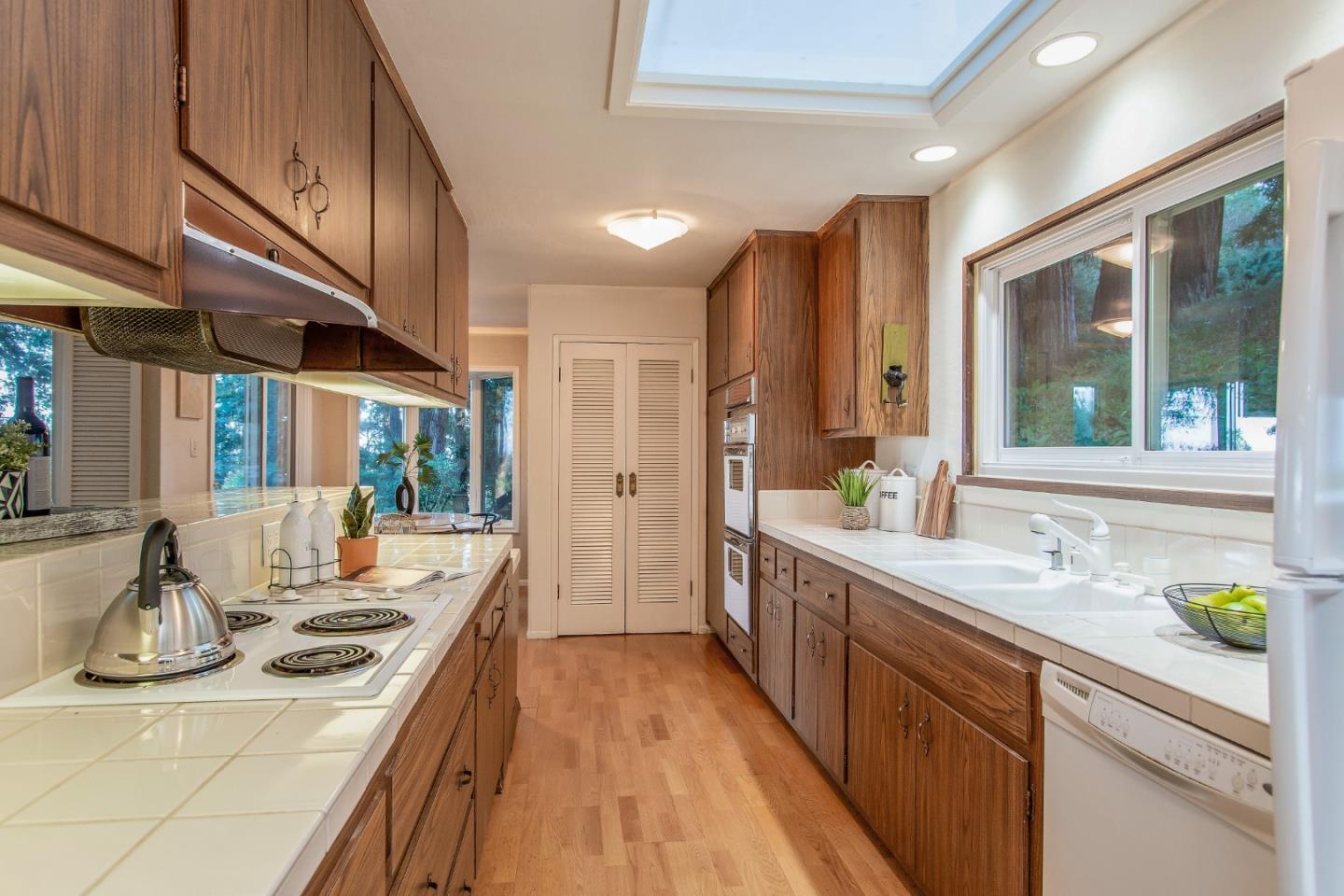 530 Summit Spring Road Woodside, CA 94062 - Photo 9 of 24 a kitchen with sink stove and cabinets