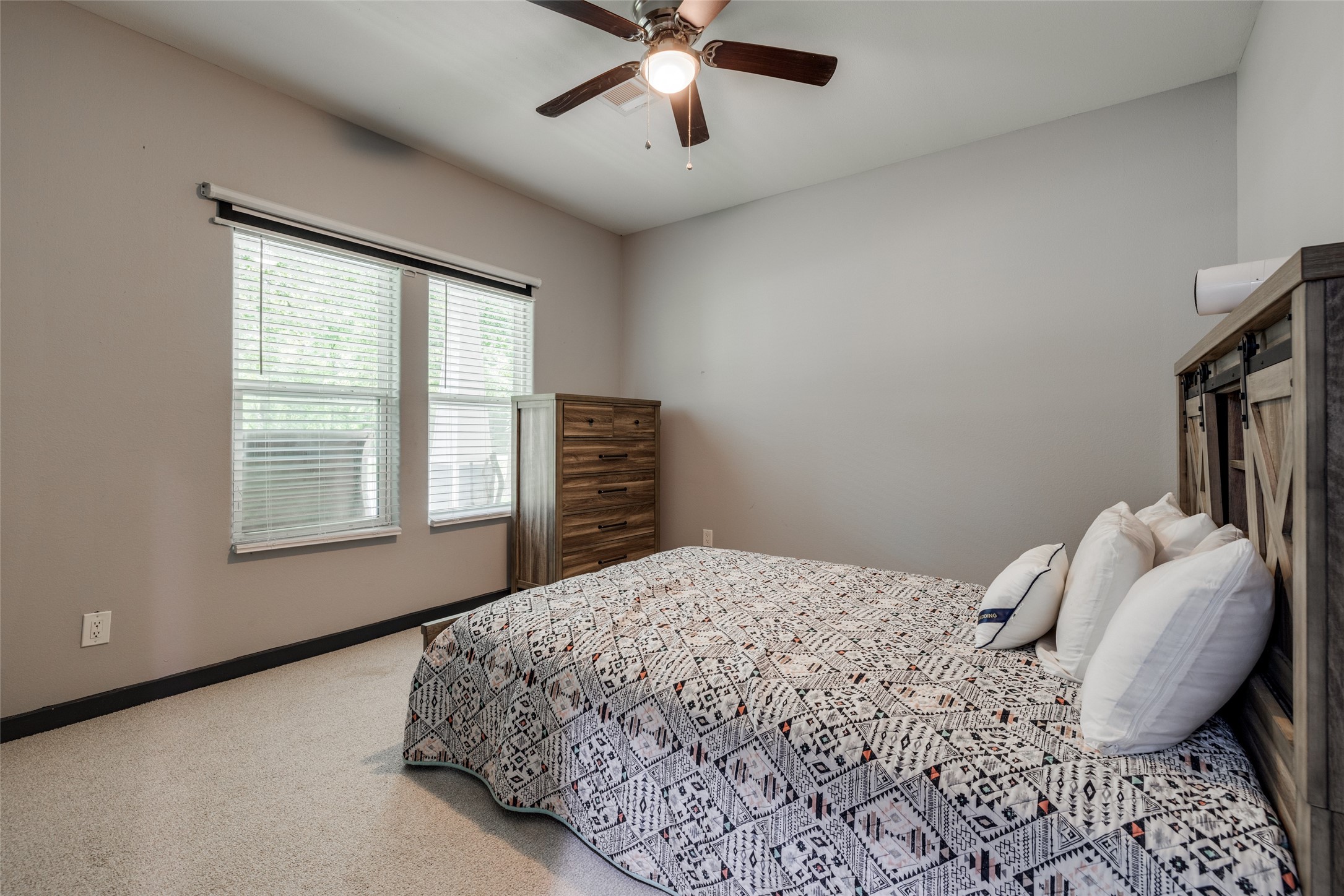 35 Disher Circle Huffman, TX 77336 - Photo 11 of 50 a bedroom with a bed and a window