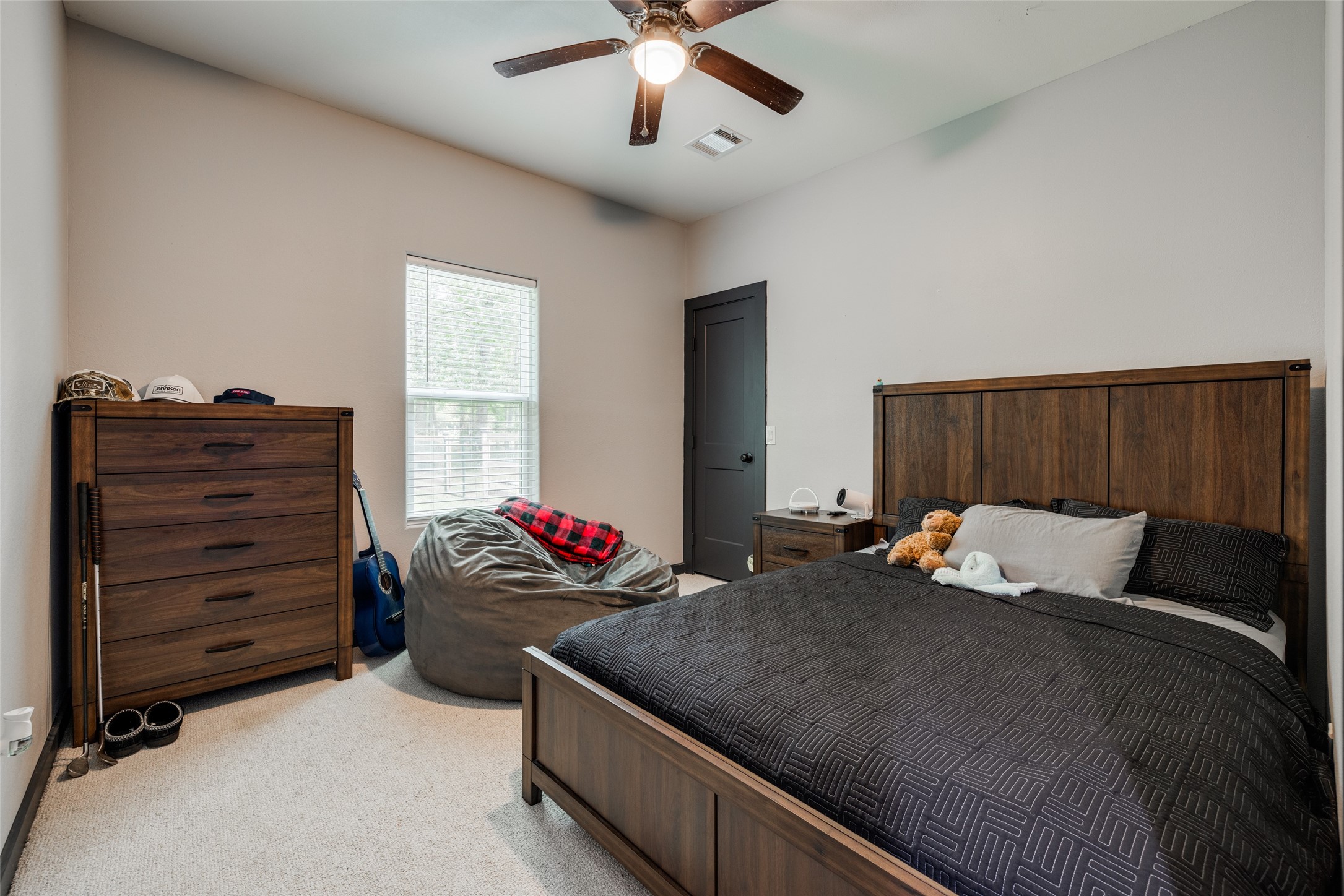 35 Disher Circle Huffman, TX 77336 - Photo 13 of 50 a bedroom with a bed and window