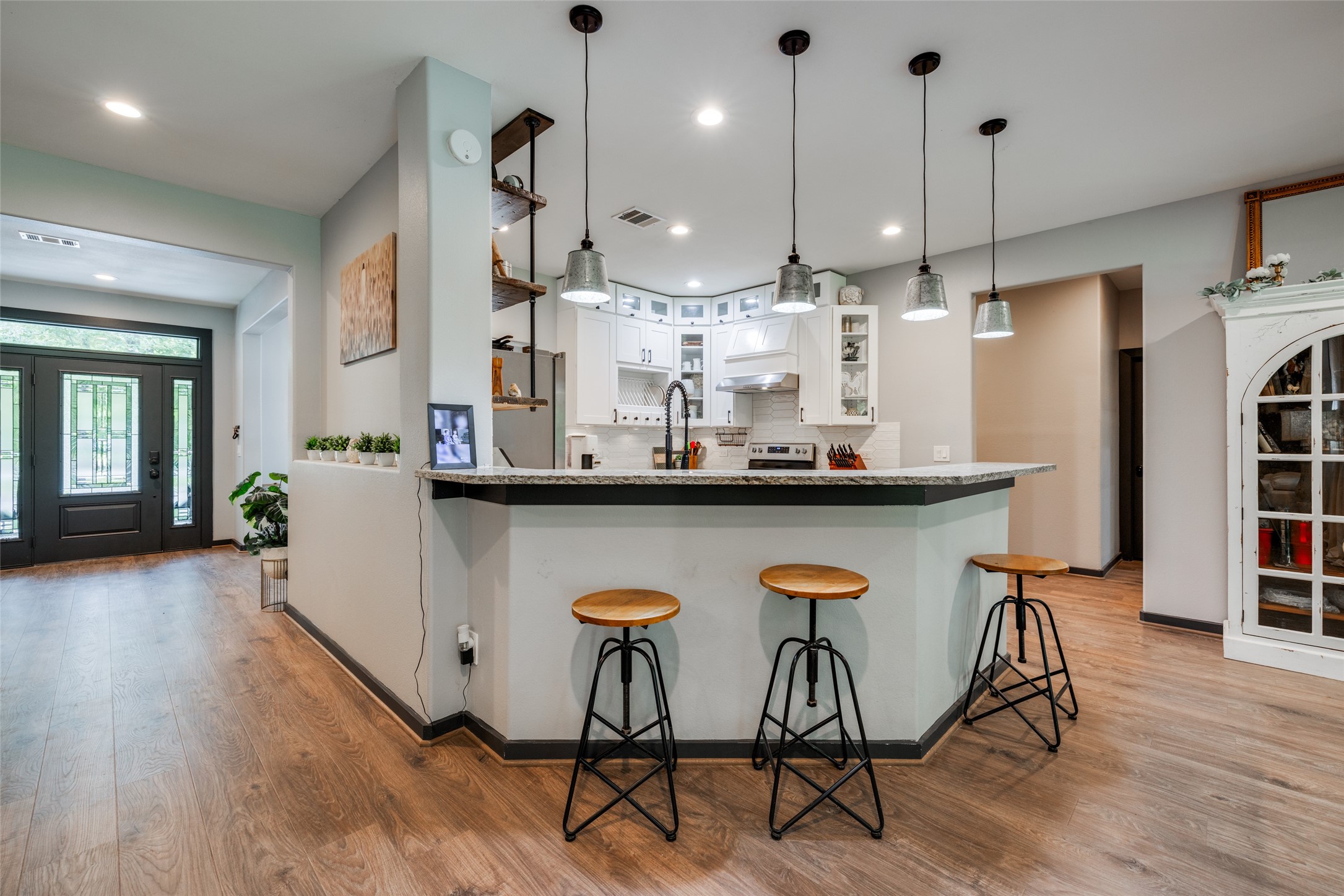 35 Disher Circle Huffman, TX 77336 - Photo 16 of 50 a kitchen with stainless steel appliances kitchen island a chandelier