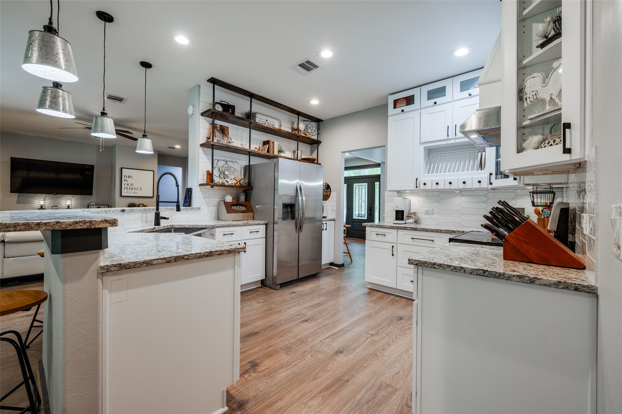 35 Disher Circle Huffman, TX 77336 - Photo 18 of 50 a kitchen with stainless steel appliances granite countertop a lot of counter top space and cabinets