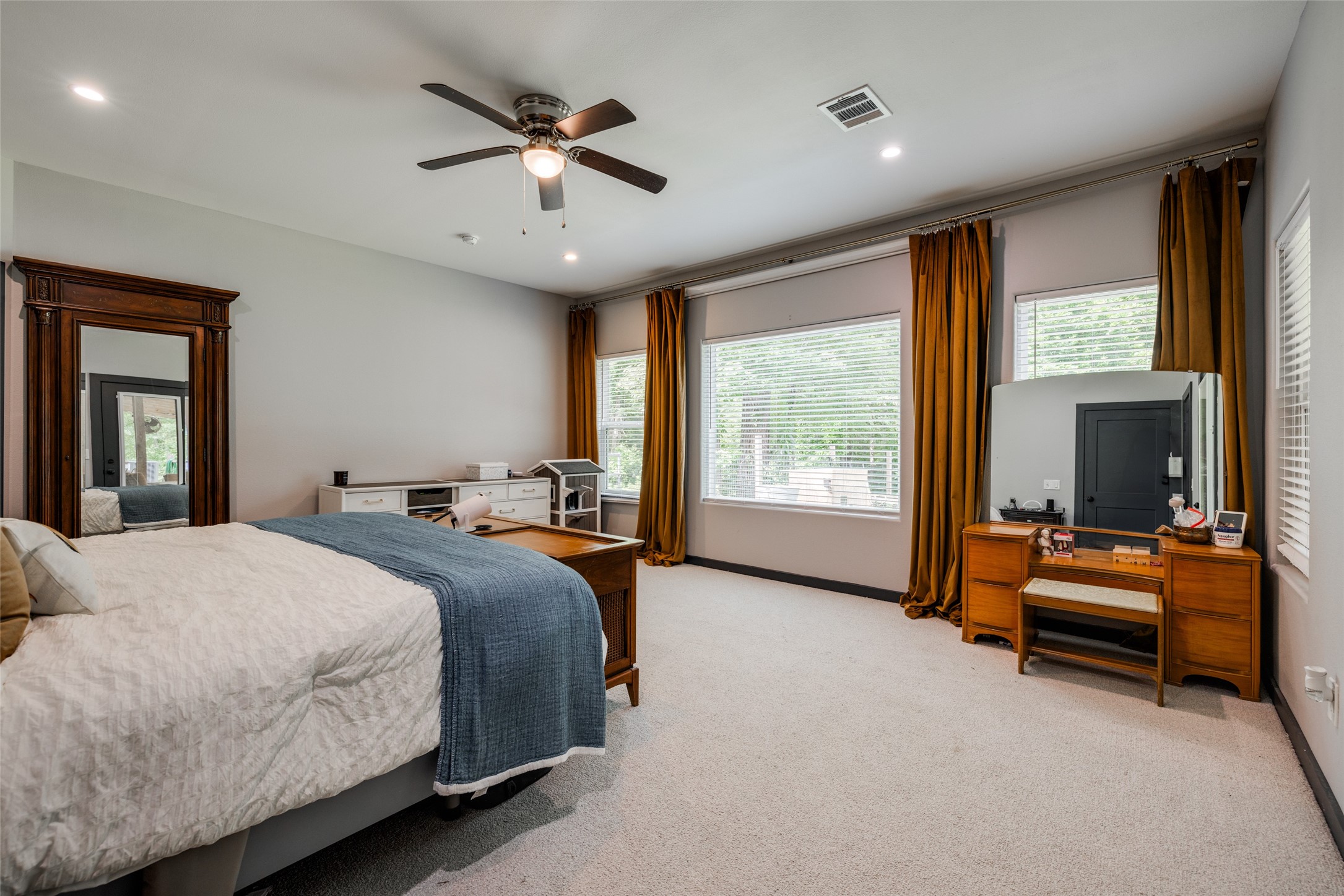 35 Disher Circle Huffman, TX 77336 - Photo 22 of 50 a bedroom with bed and a large window