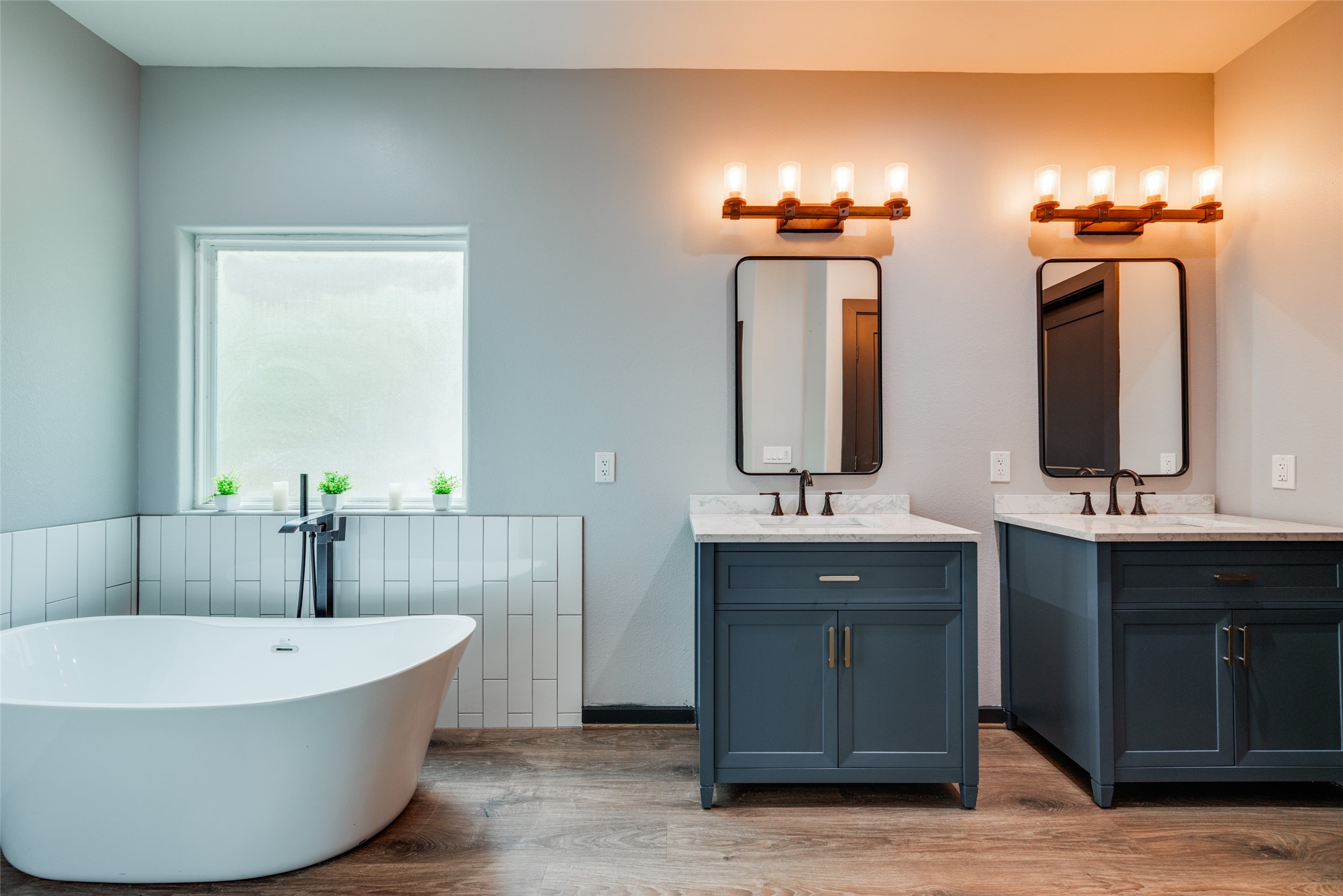 35 Disher Circle Huffman, TX 77336 - Photo 23 of 50 a bathroom with a tub sink and mirror