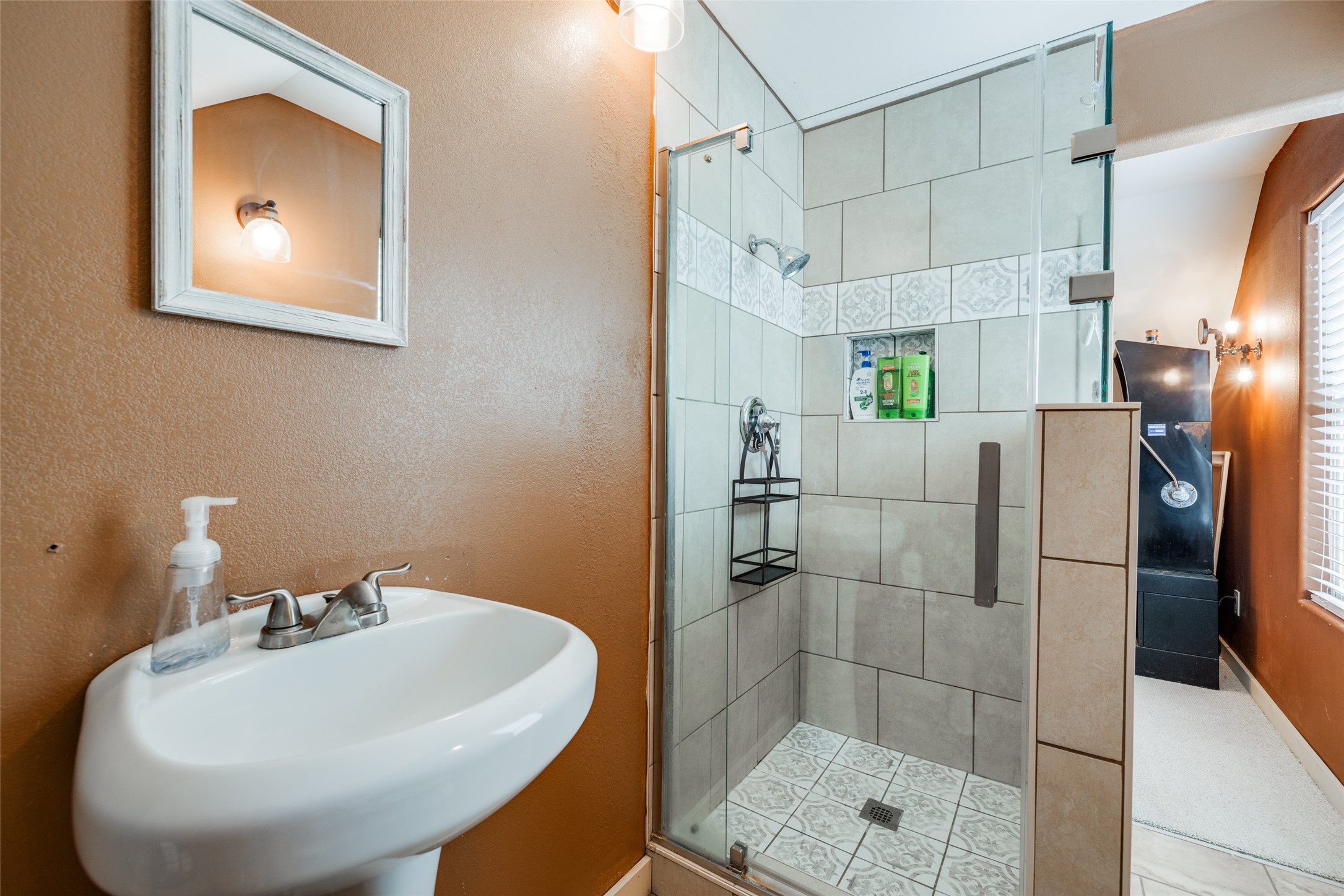 35 Disher Circle Huffman, TX 77336 - Photo 29 of 50 a bathroom with a sink a toilet and shower