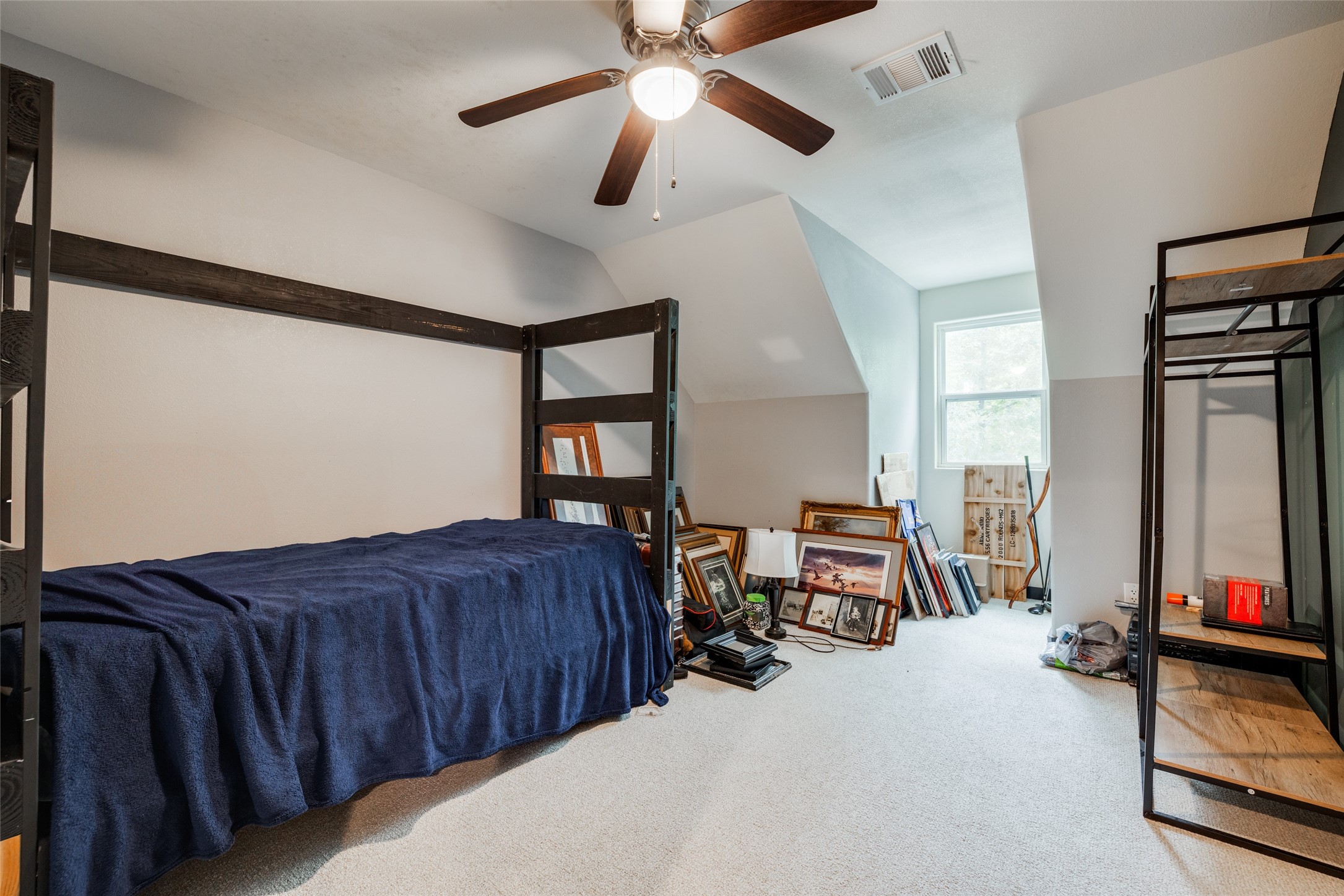 35 Disher Circle Huffman, TX 77336 - Photo 32 of 50 a bed room with furniture and a flat screen tv