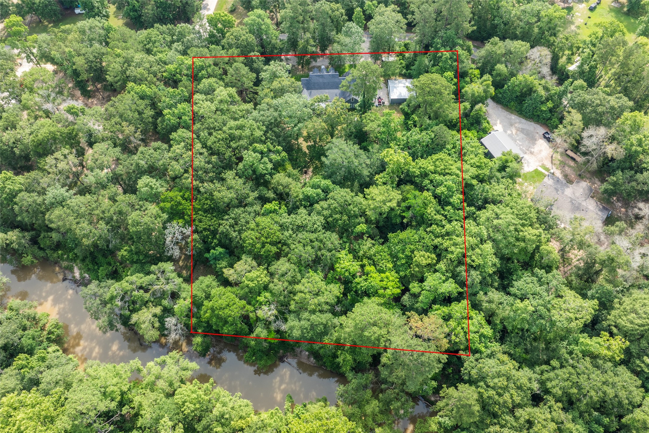 35 Disher Circle Huffman, TX 77336 - Photo 50 of 50 an aerial view of a house with a lush green forest
