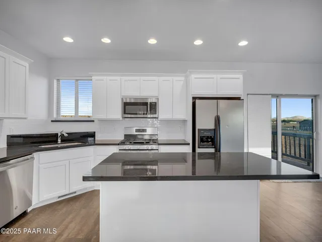 a large kitchen with cabinets