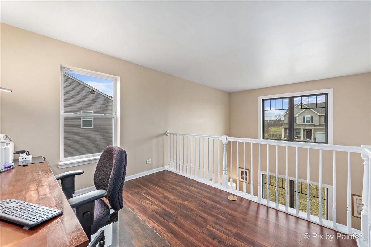 4902 Stillwater Road Wonder Lake, IL 60097 - Photo 20 of 46 a workspace with wooden floor and a window