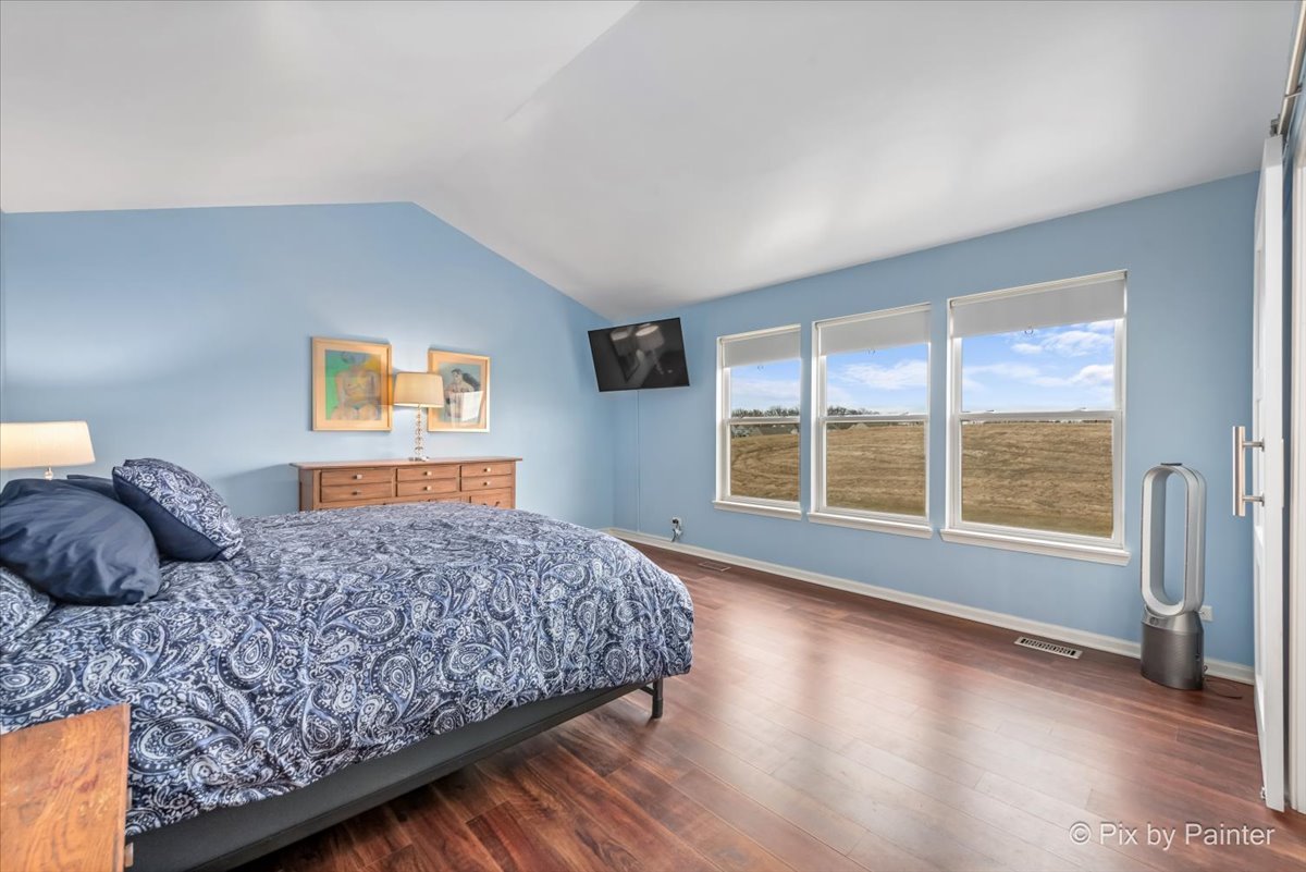 4902 Stillwater Road Wonder Lake, IL 60097 - Photo 27 of 46 a bedroom with a large bed and a large window