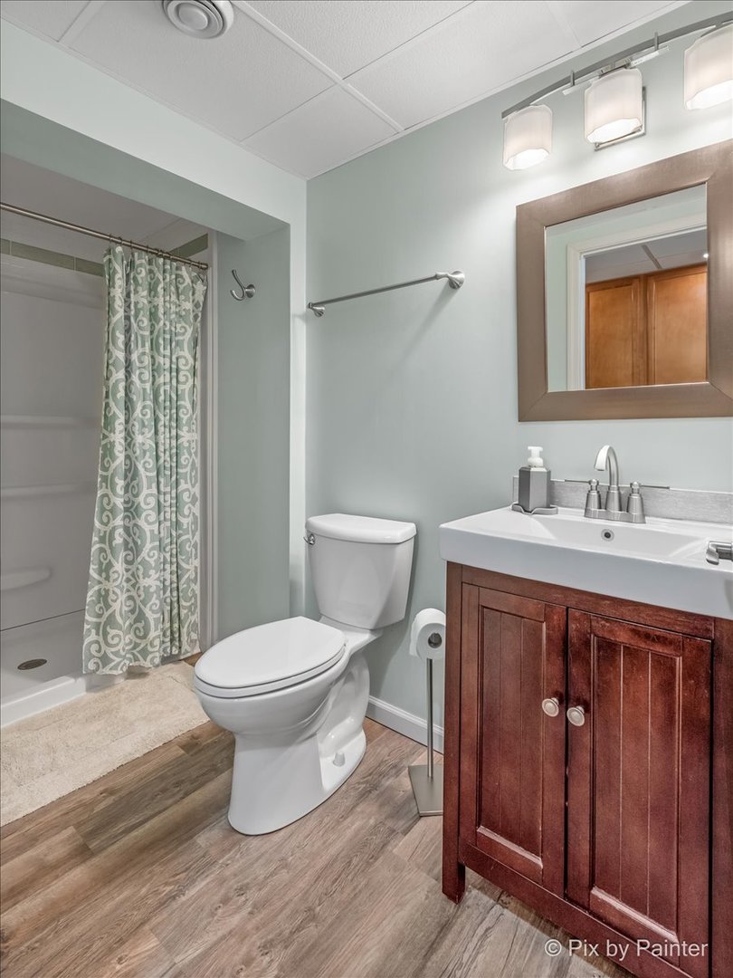 4902 Stillwater Road Wonder Lake, IL 60097 - Photo 34 of 46 a bathroom with a sink toilet and shower