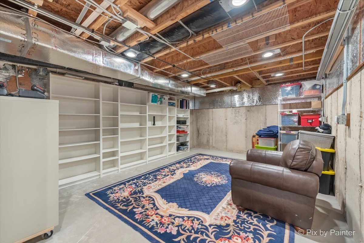 4902 Stillwater Road Wonder Lake, IL 60097 - Photo 37 of 46 a living room with furniture and a wooden floor