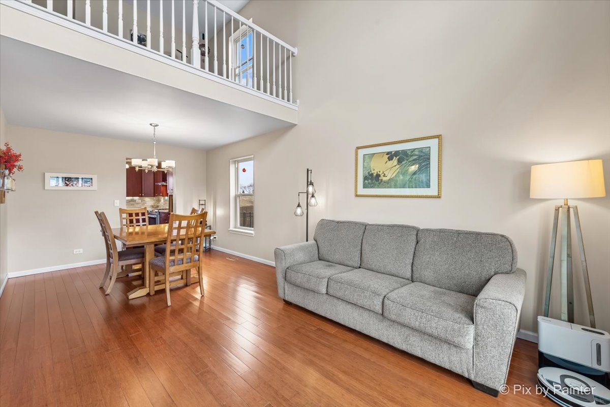 4902 Stillwater Road Wonder Lake, IL 60097 - Photo 6 of 46 a living room with furniture and a wooden floor