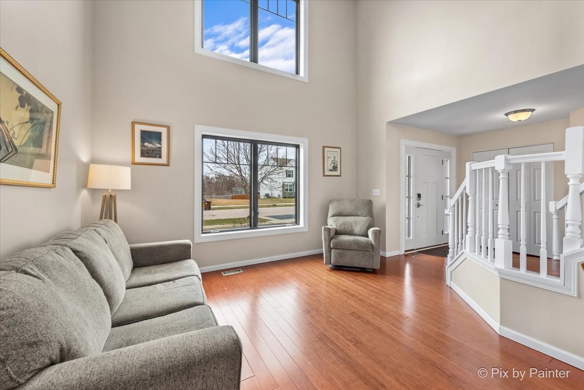 4902 Stillwater Road Wonder Lake, IL 60097 - Photo 8 of 46 a living room with furniture and a window