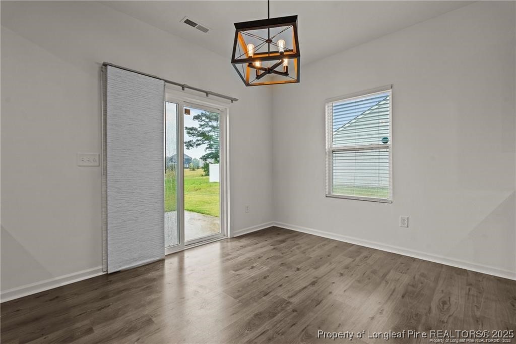 40 Arlie Lane Lillington, NC 27546 - Photo 12 of 39 a view of an empty room with wooden floor and a window