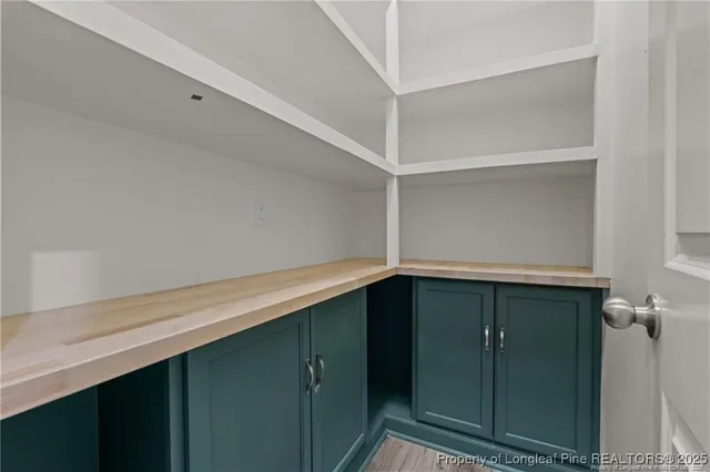 a view of a livingroom with a ceiling fan and window