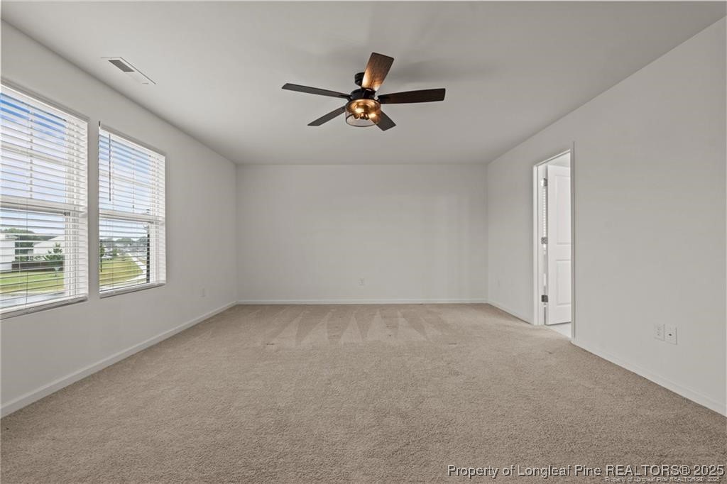40 Arlie Lane Lillington, NC 27546 - Photo 21 of 39 a view of a livingroom with a ceiling fan and window