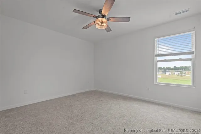 a view of a house with swimming pool and sitting area