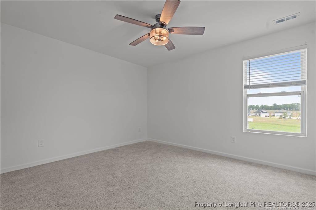 40 Arlie Lane Lillington, NC 27546 - Photo 34 of 39 an empty room with a window and a fan
