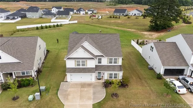 a view of a house with a big yard