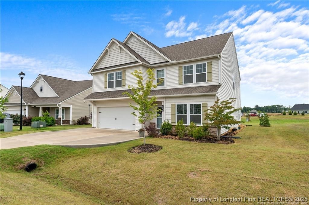 40 Arlie Lane Lillington, NC 27546 - Photo 4 of 39 a front view of a house with a garden