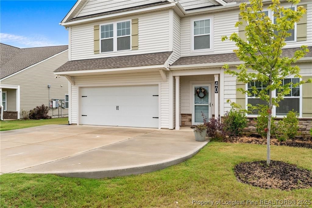 40 Arlie Lane Lillington, NC 27546 - Photo 5 of 39 a front view of a house with garden
