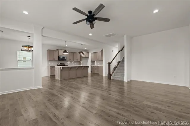 a view of kitchen with cabinets and wooden floor