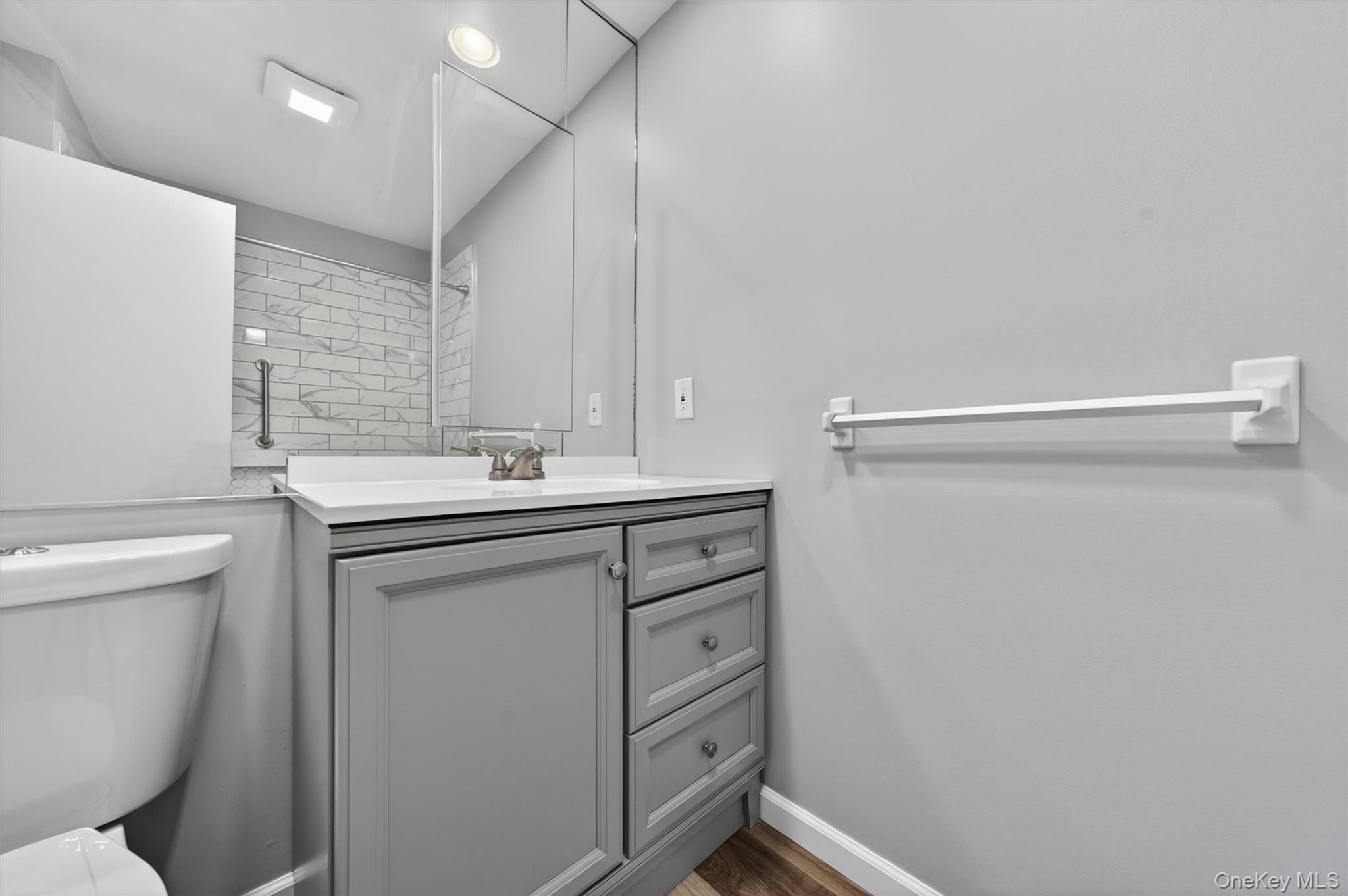 43 The Rise Warwick, NY 10990 - Photo 33 of 49 a bathroom with a sink a toilet and a mirror